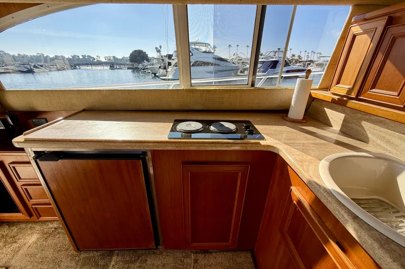 Slide: The Image of Interior of 1996 Egg Harbor 35 Sport Fisherman with kitchenette and marina view. - 28
