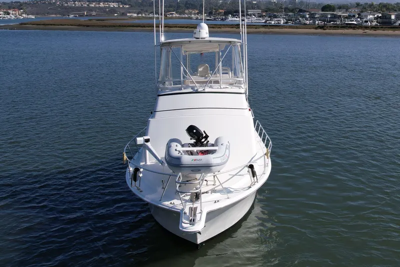 Slide: The Image of 1996 Egg Harbor 35 Sport Fisherman boat on calm water, front view. - 4