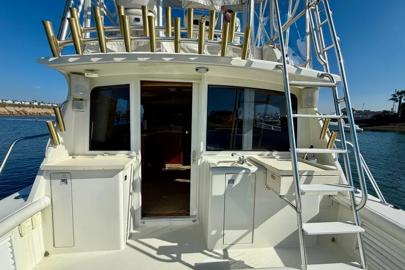 Slide: The Image of 1996 Egg Harbor 35 Sport Fisherman boat with ladder and fishing rod holders. - 43