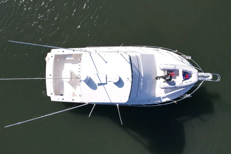 Slide: The Image of Overhead view of a 1996 Egg Harbor 35 Sport Fisherman boat on water. - 5