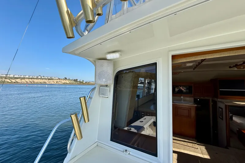 Slide: The Image of 1996 Egg Harbor 35 Sport Fisherman boat with open cabin and scenic water view. - 51