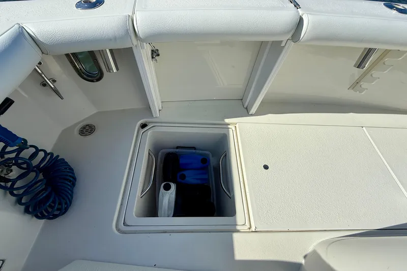 Slide: The Image of 1996 Egg Harbor 35 Sport Fisherman deck with storage compartment open. - 52