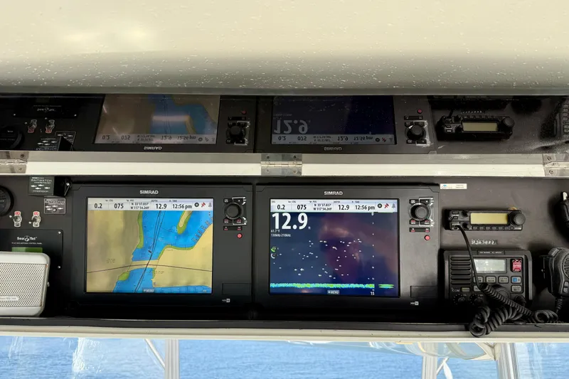 Slide: The Image of 1996 Egg Harbor 35 Sport Fisherman dashboard with navigation and communication equipment. - 55