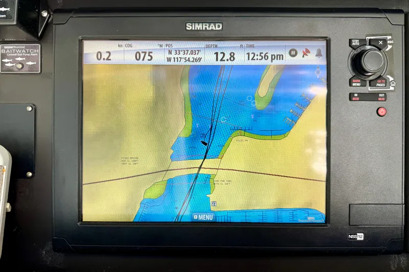 Slide: The Image of Simrad navigation display on 1996 Egg Harbor 35 Sport Fisherman, showing nautical chart and coordinates. - 58