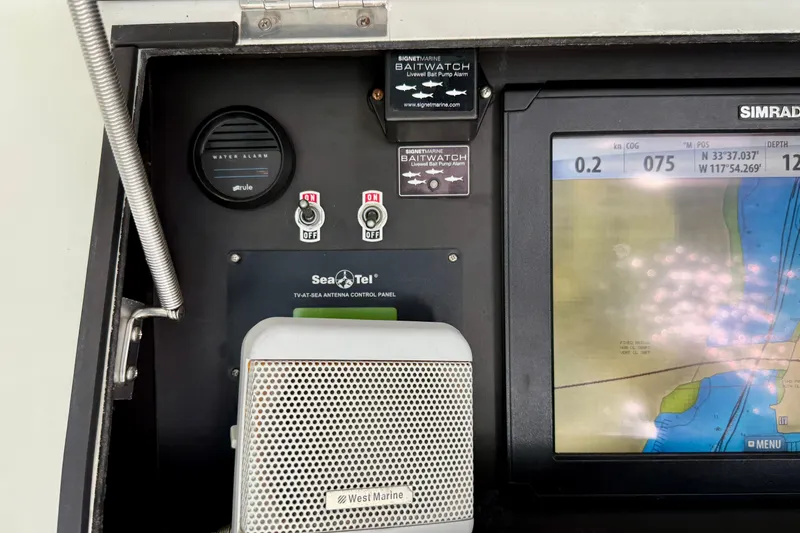 Slide: The Image of Control panel of a 1996 Egg Harbor 35 Sport Fisherman with navigation display and alarms. - 59