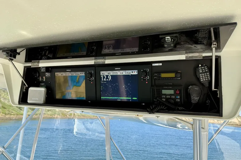 Slide: The Image of 1996 Egg Harbor 35 Sport Fisherman dashboard with navigation and communication equipment. - 60