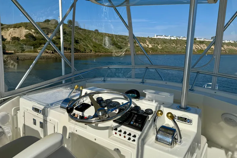 Slide: The Image of 1996 Egg Harbor 35 Sport Fisherman helm with scenic coastal view. - 62