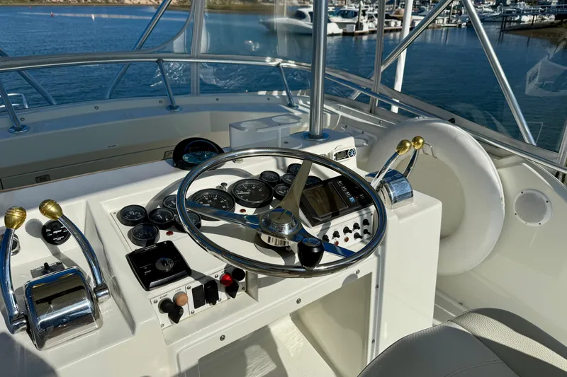 Slide: The Image of Helm of 1996 Egg Harbor 35 Sport Fisherman with steering wheel and controls. - 63