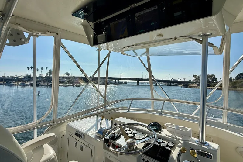 Slide: The Image of 1996 Egg Harbor 35 Sport Fisherman helm with scenic marina view. - 67