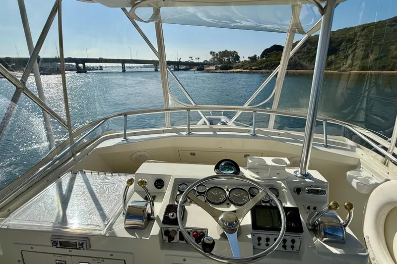 Slide: The Image of 1996 Egg Harbor 35 Sport Fisherman boat helm with scenic waterway view. - 68