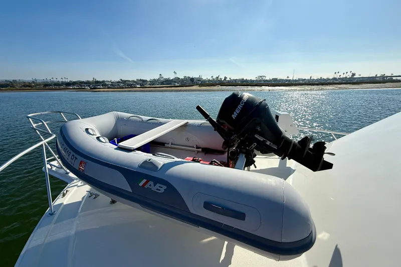 Slide: The Image of Inflatable boat with motor on 1996 Egg Harbor 35 Sport Fisherman yacht, scenic water view. - 70