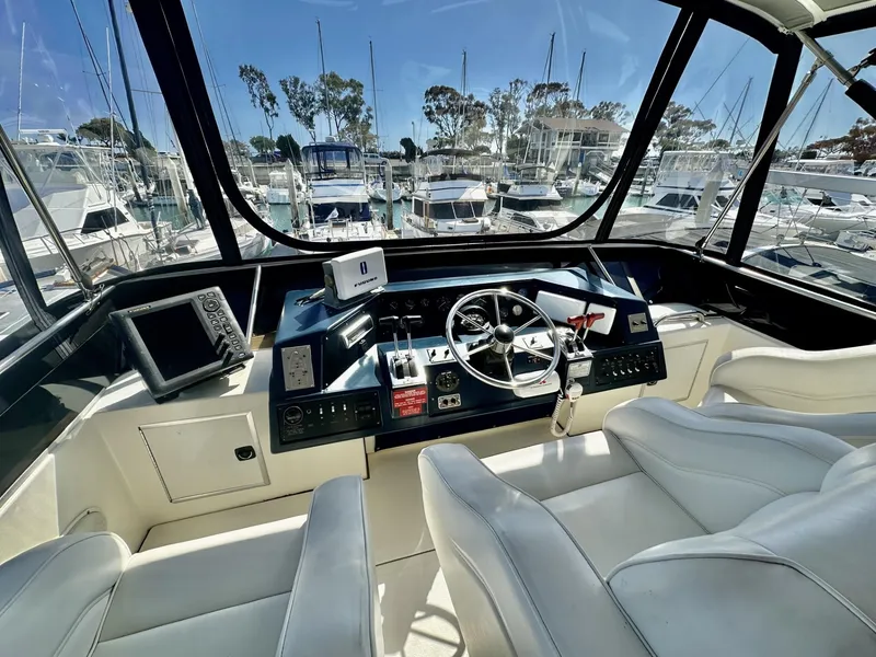 Slide: The Image of Interior view of 1990 Sea Ray 380 Aft Cabin cockpit with steering wheel. - 14