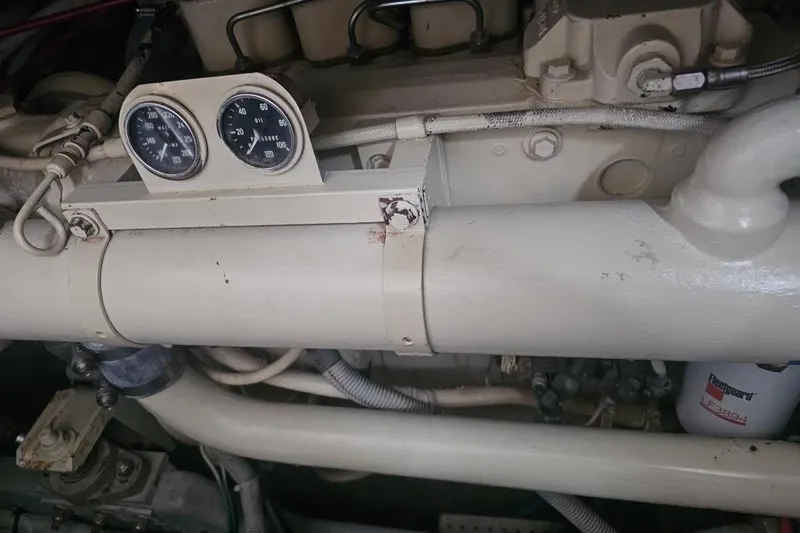 Slide: The Image of Engine compartment of a 1990 Sea Ray 380 Aft Cabin with gauges and pipes. - 16