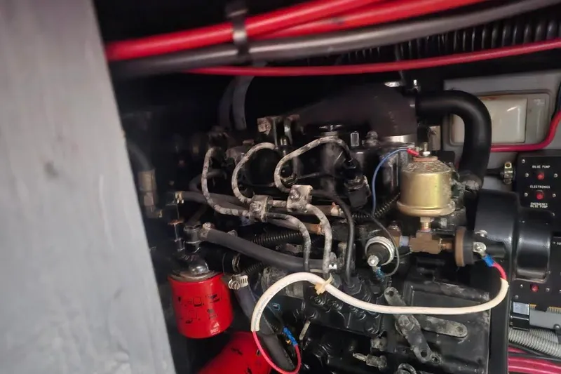 Slide: The Image of Engine compartment of a 1990 Sea Ray 380 Aft Cabin boat, showing mechanical components. - 17