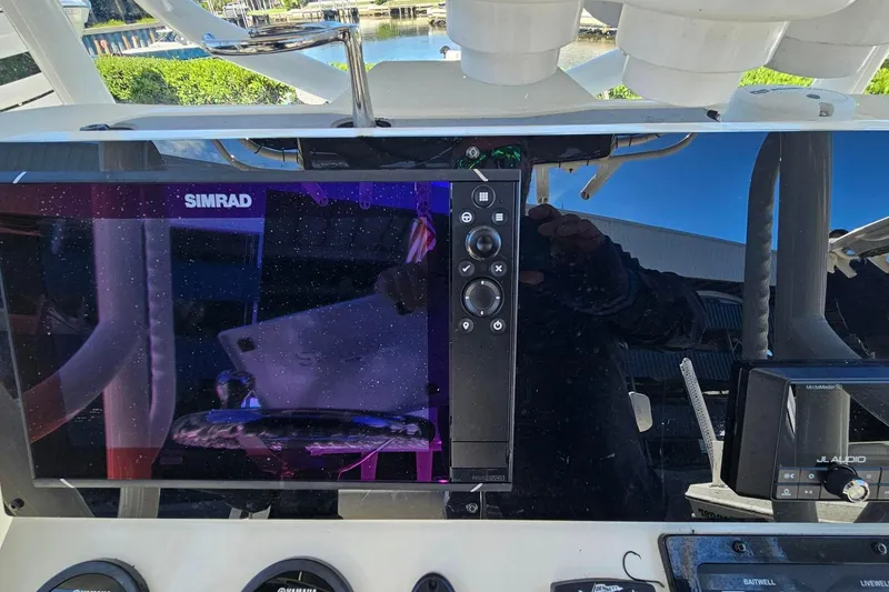 Slide: The Image of 2021 Skeeter SX2250 boat dashboard with Simrad navigation system. - 11