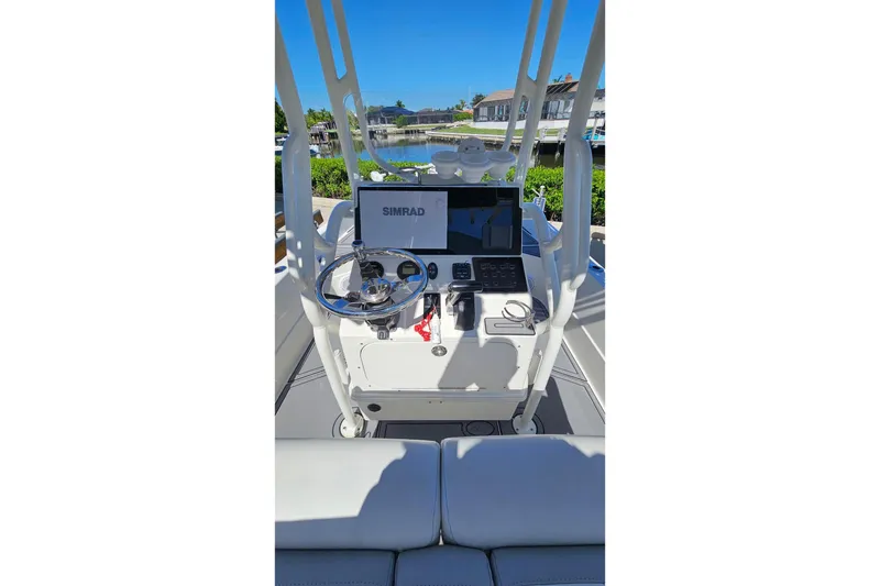 Slide: The Image of 2021 Skeeter SX2250 boat console with Simrad display and steering wheel. - 6