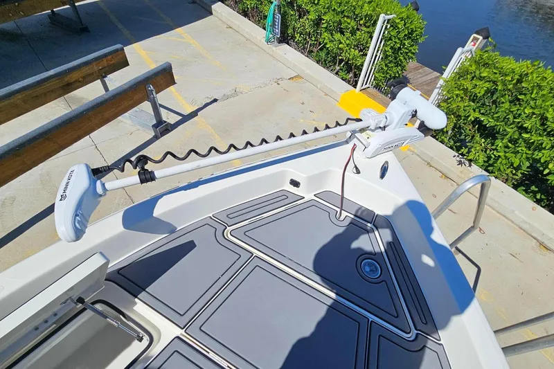 Slide: The Image of 2021 Skeeter SX2250 boat with Minn Kota trolling motor at dockside. - 8