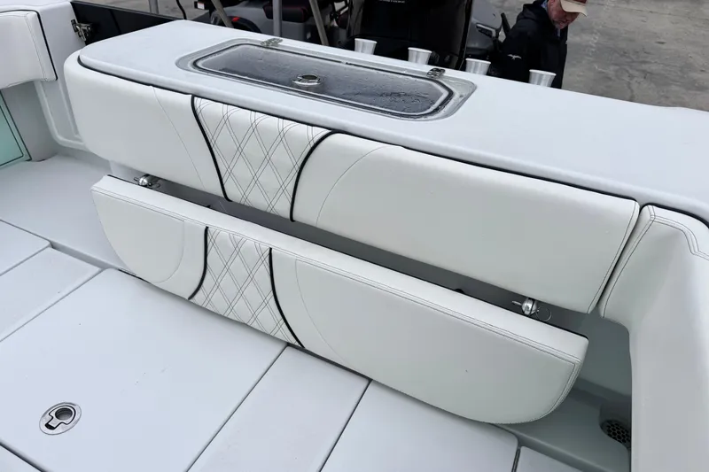 Slide: The Image of 2021 Contender 25 Tournament boat seating with storage and rod holders. - 13