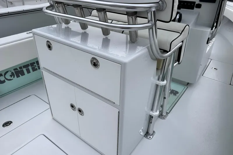 Slide: The Image of 2021 Contender 25 Tournament boat interior with storage and seating. - 14