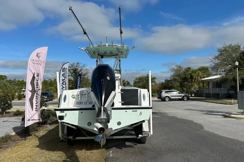 Slide: The Image of 2021 Contender 25 Tournament boat displayed outdoors with promotional flags and clear sky. - 3