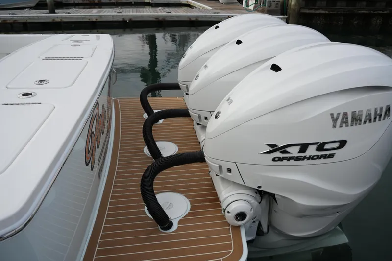 Slide: The Image of 2025 Regulator 37 boat with triple Yamaha XTO Offshore engines at dock. - 25