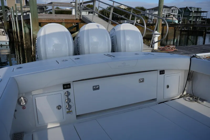 Slide: The Image of 2025 Regulator 37 boat with triple engines docked at marina. - 26