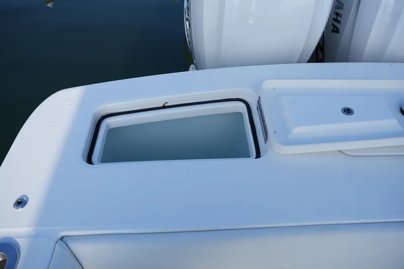 Slide: The Image of 2025 Regulator 37 boat deck with storage compartment and Yamaha engines. - 27