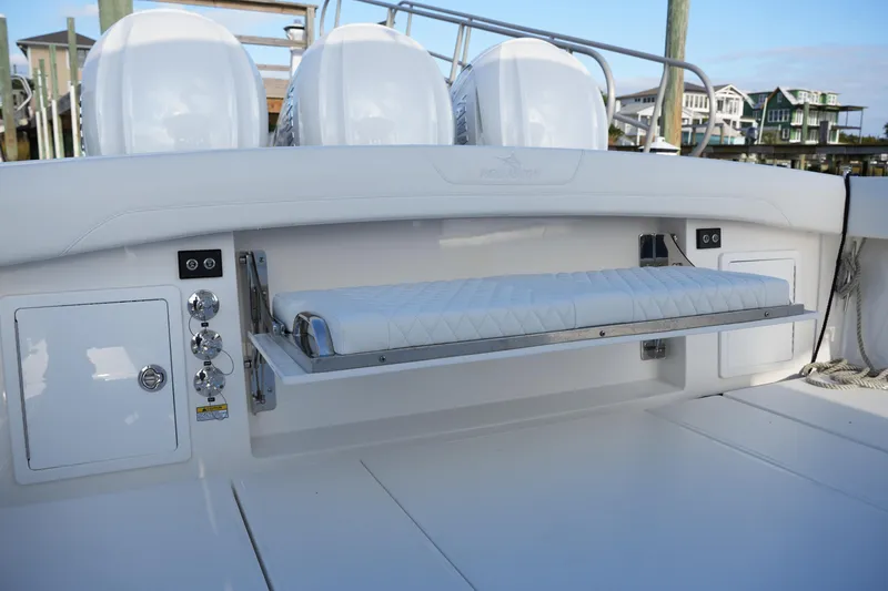 Slide: The Image of 2025 Regulator 37 boat with foldable bench seat and engine controls. - 30