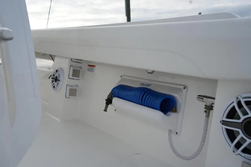 Slide: The Image of 2025 Regulator 37 boat interior with hose storage and speakers. - 41