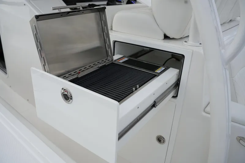 Slide: The Image of Built-in grill on 2025 Regulator 37 boat, open drawer view. - 48