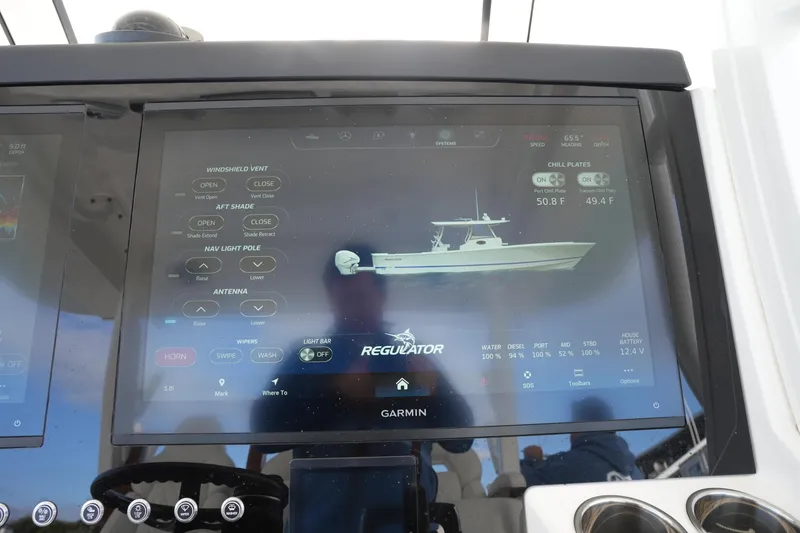 Slide: The Image of Touchscreen display on 2025 Regulator 37 boat showing navigation and system controls. - 55