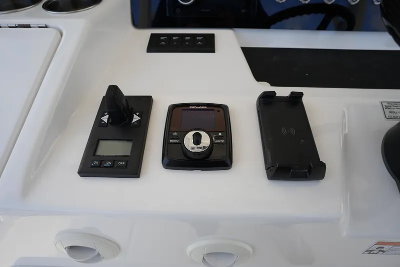Slide: The Image of Control panel of 2025 Regulator 37 boat with navigation and docking controls. - 57