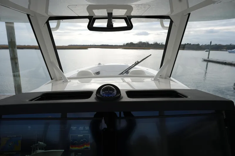 Slide: The Image of Interior view of 2025 Regulator 37 boat cockpit with navigation display. - 60