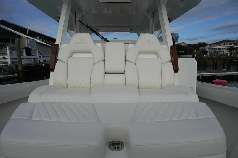 Slide: The Image of Luxurious seating on 2025 Regulator 37 boat, featuring elegant white upholstery. - 62