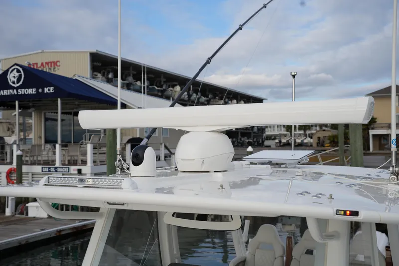 Slide: The Image of 2025 Regulator 37 boat with advanced radar system at marina dock. - 66