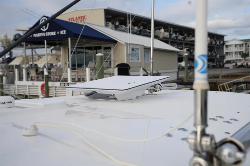 Slide: The Image of 2025 Regulator 37 boat with advanced navigation equipment at marina dock. - 68