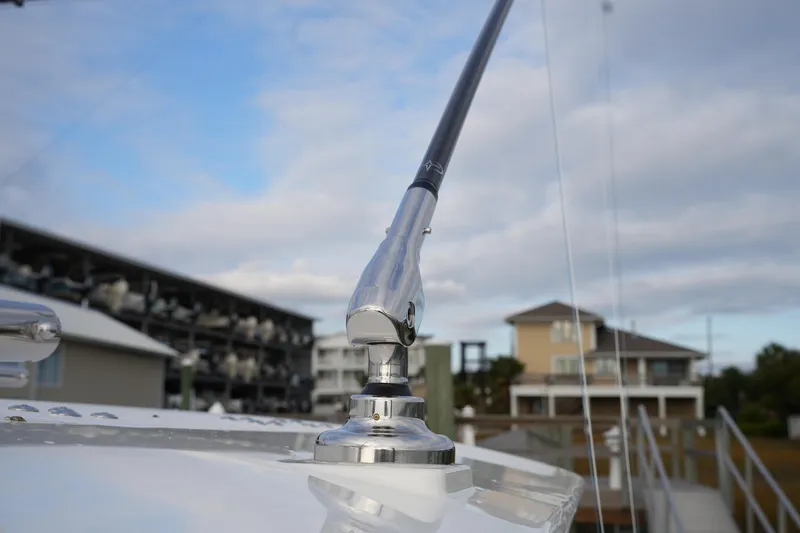 Slide: The Image of 2025 Regulator 37 boat detail with polished metal fitting against a marina backdrop. - 69