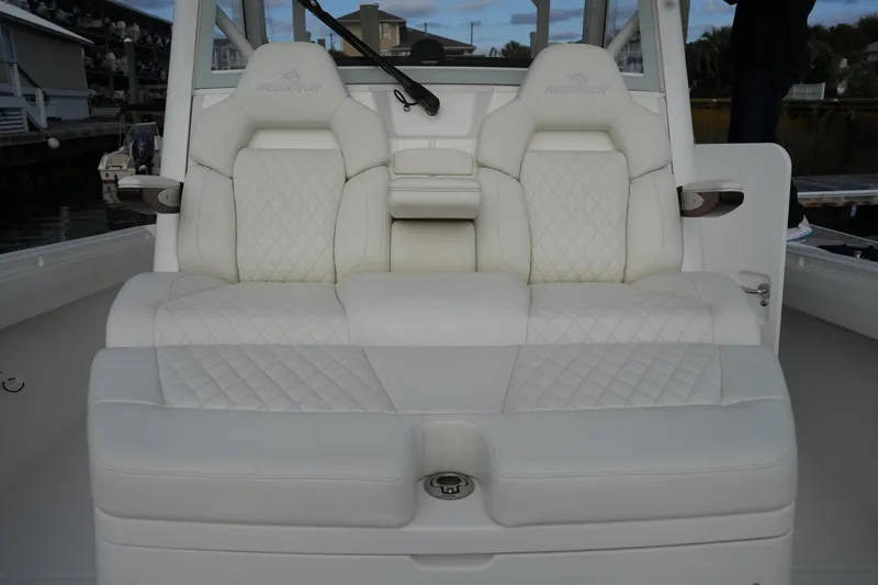 Slide: The Image of Luxurious seating on 2025 Regulator 37 boat, featuring elegant white upholstery and diamond stitching. - 77