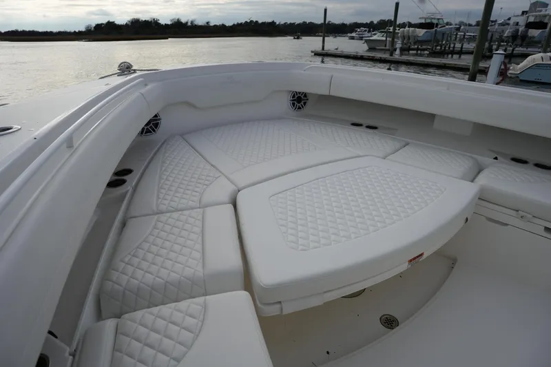 Slide: The Image of Luxurious seating on 2025 Regulator 37 boat, docked at marina. - 80