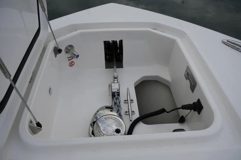 Slide: The Image of Anchor compartment of 2025 Regulator 37 boat with winch and chain. - 83