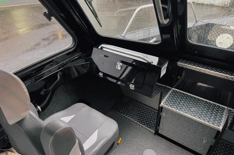 Slide: The Image of Interior of 2026 Hewescraft 240 Ocean Pro ET HT boat, featuring seating and storage. - 7