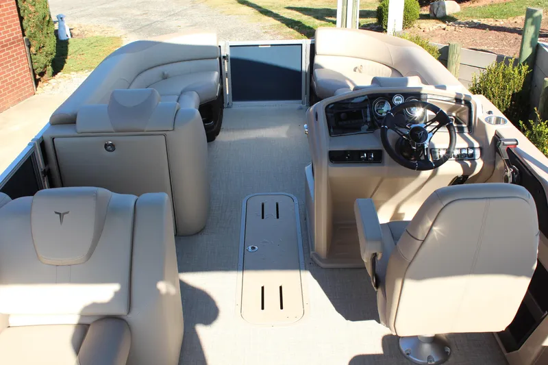Slide: The Image of 2026 Tahoe Pontoon LTZ Elite interior with luxurious seating and modern dashboard. - 11