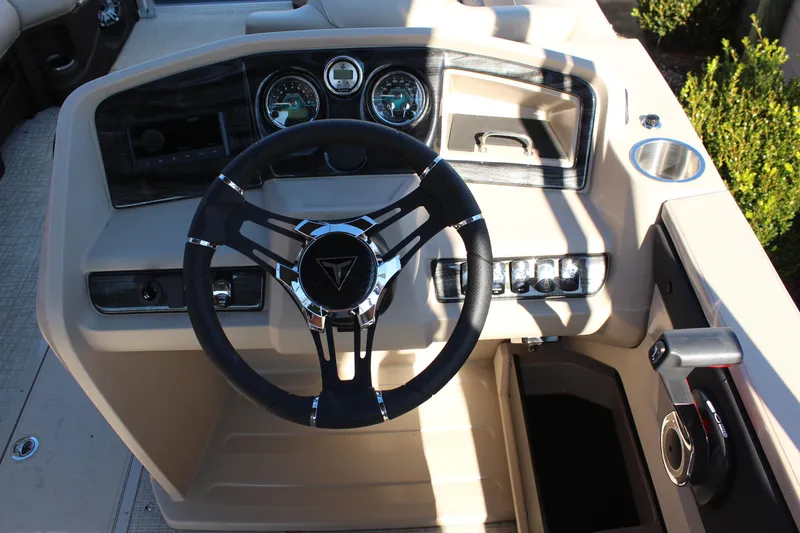 Slide: The Image of 2026 Tahoe Pontoon LTZ Elite dashboard with steering wheel and control panel. - 12