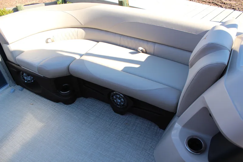 Slide: The Image of 2026 Tahoe Pontoon LTZ Elite interior with luxurious seating and integrated speakers. - 14