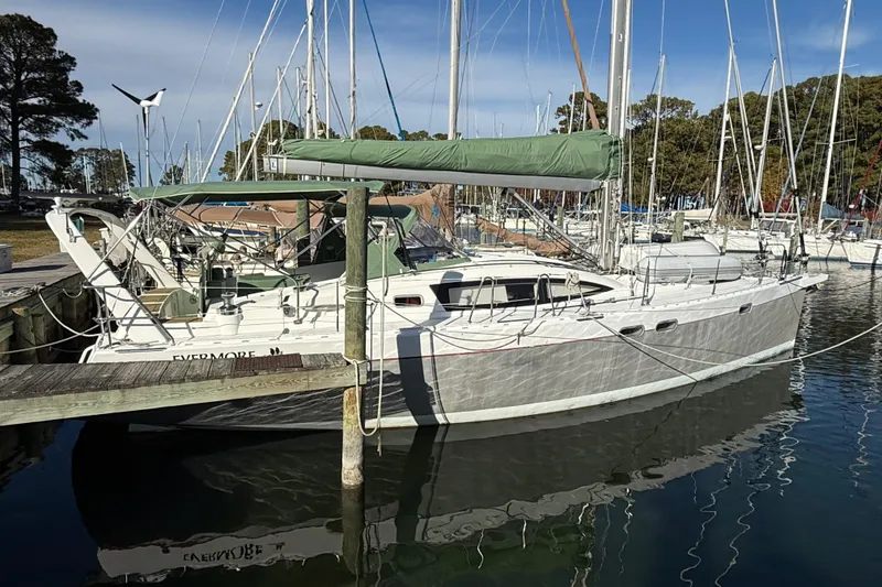 The Image of Sailboat Allures 45, 2011 model, docked at marina with green sail cover. - 0