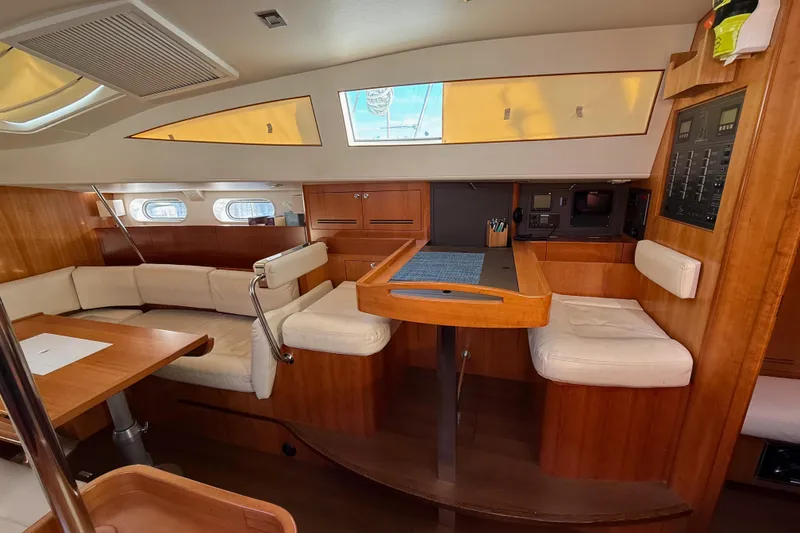 Slide: The Image of Interior of 2011 Allures 45 yacht with wooden furnishings and seating area. - 5