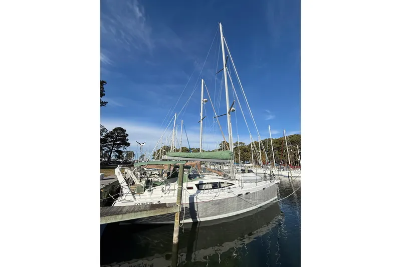 Slide: The Image of Sailboat Allures 45, 2011 model, docked in a marina under clear blue skies. - 9