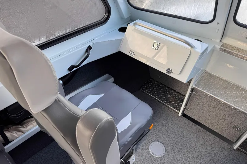 Slide: The Image of Interior of 2026 Hewescraft 210 Sea Runner ET HT, featuring seating and storage. - 6