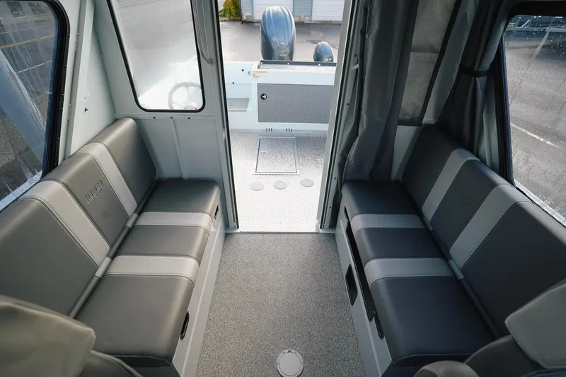 Slide: The Image of 2026 Hewescraft 210 Sea Runner ET HT interior with gray seating and spacious layout. - 7