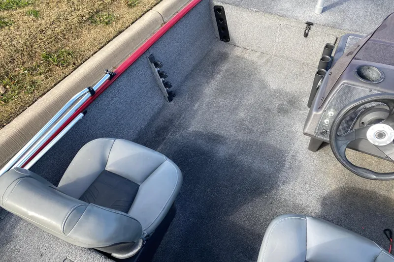 Slide: The Image of 2021 Tracker Bass Tracker Classic XL boat interior with seats and steering wheel. - 10